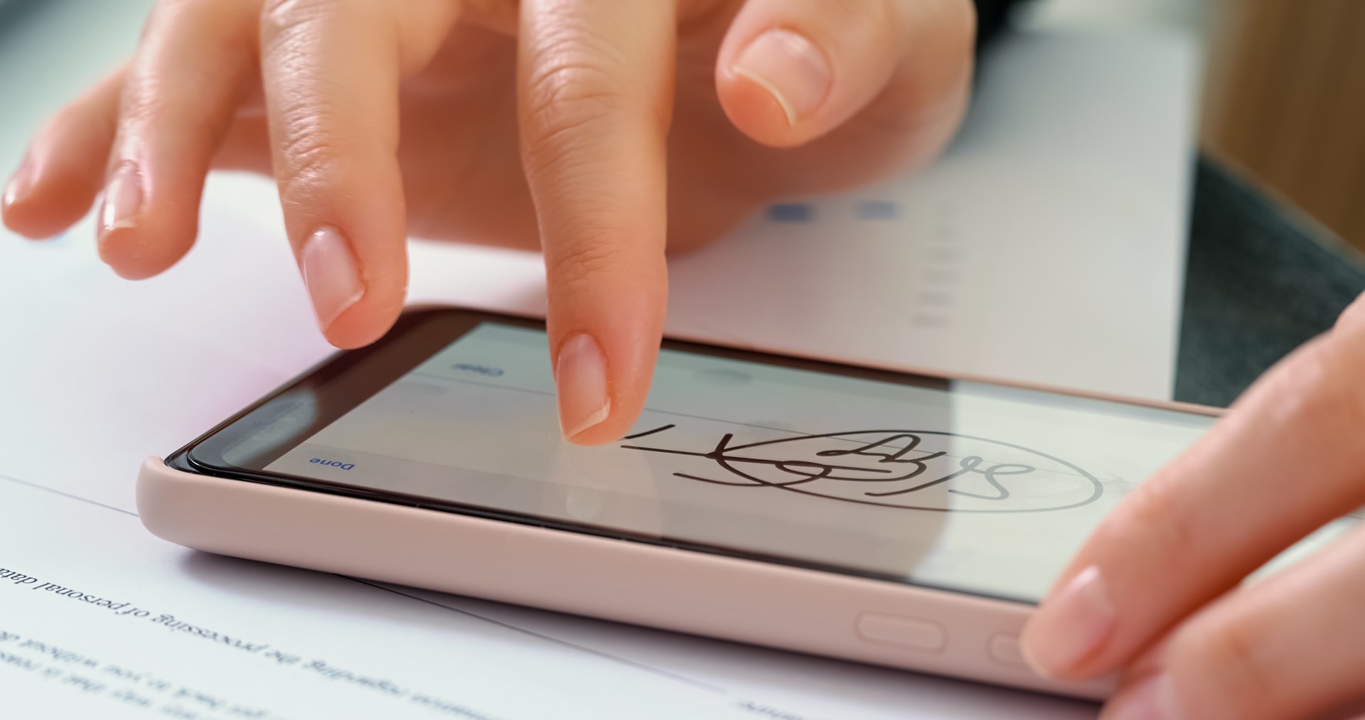 Electronic Signature on smartphone screen.